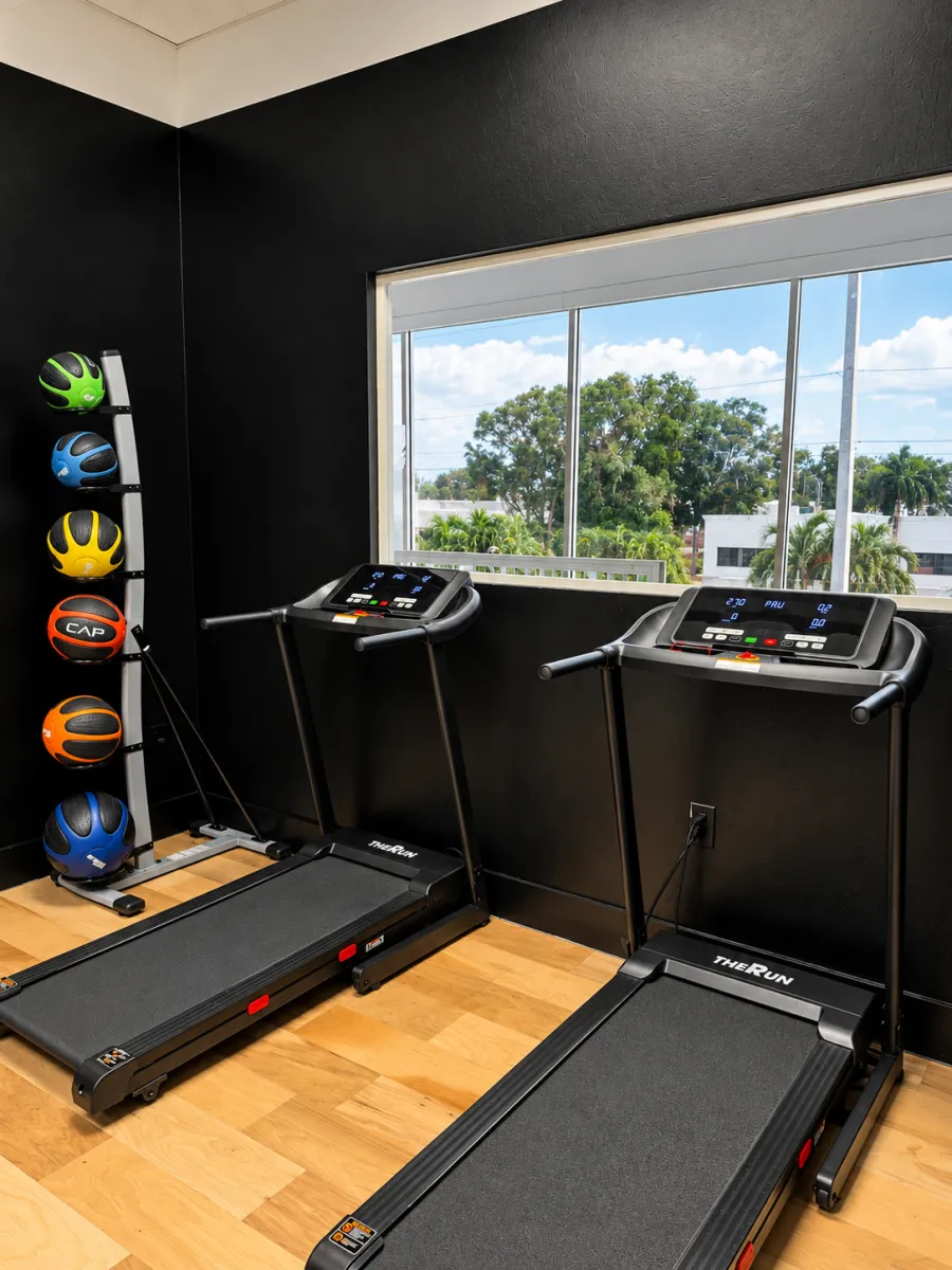 Treadmills by the window at BodyRhythm